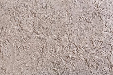 Close-up surface detail of old rough white plaster wall texture, macro. Stock Photos