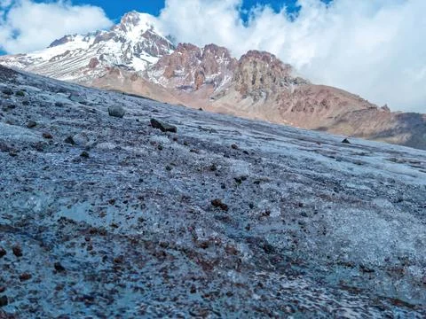 A close up on the surface of Gergeti Glacier, with the view on Mount Kazbeg.. Stock Photos