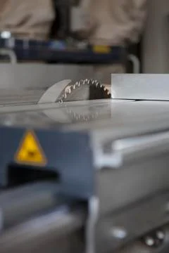 Close-up, surface level perspective of sliding table saw in workshop Stock Photos