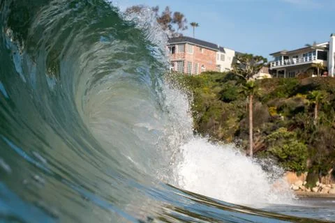 Close up surface level view of rolling wave and beach, Laguna Beach, California, Stock Photos