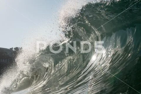 Close up surface level view of rolling wave and beach, Laguna Beach ...