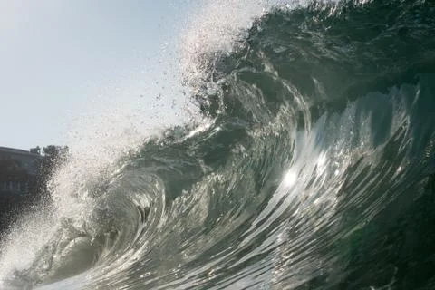 Close up surface level view of rolling wave and beach, Laguna Beach, California, Stock Photos