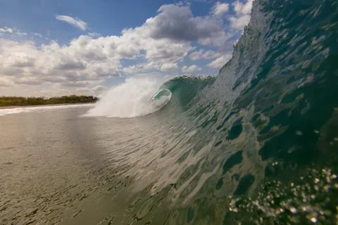 Close up surface level view of rolling wave and beach, Laguna Beach, California, Stock Photos