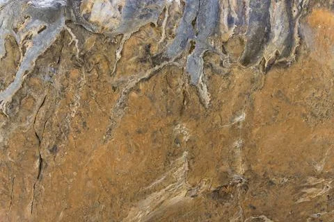 Close up of the surface of an orange rock Stock Photos