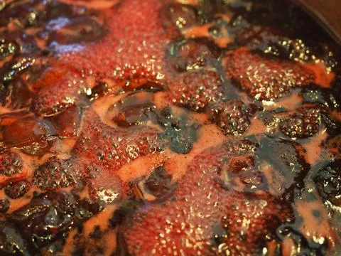 A close-up of the surface of some boiling fruit being used to make jam Stock Photos
