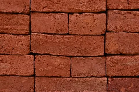 Close up surface view of the fresh bricks stacked in a construction site Stock Photos