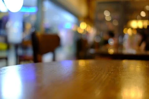Close up Surface of Wooden Table in Cafe with Bokeh Background. Stock Photos