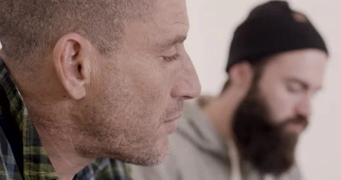 Close up of surfer David Langer eating and having conversation with his friends Video stock 160508584