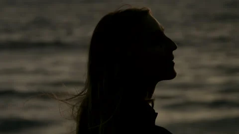 Close up of a Surfer Looking out Towards the Ocean at Sunset Stock Footage 270293581
