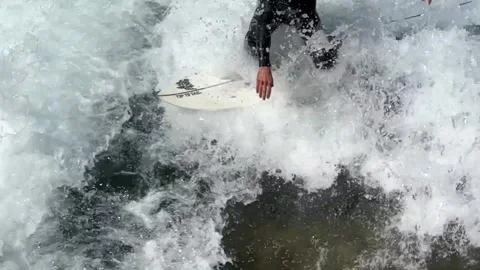 Close Up on a Surfer Surfing the Wave in a Sunny Summer Day in Switzerland Slow Stock Footage 252050771