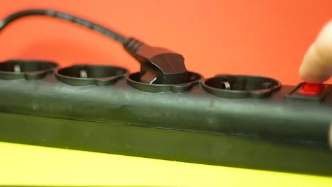 Close-up Surge Protector Hand Turns On Red On Button Power Source Of Home Electr Vídeos de archivo 151522498