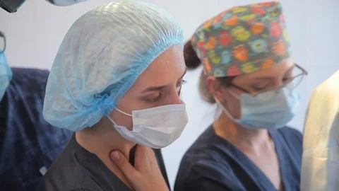 Close-up. surgeon face during surgery. in a protective, sterile mask. in a surgi Stock-Footage 99198098
