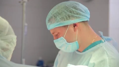 Close-up. surgeon face during surgery. in a protective, sterile mask. Stock Footage 135309952