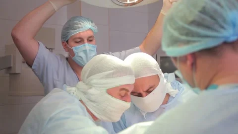 Close-up. surgeon face during surgery. in a protective, sterile mask. Stock Footage 135310017