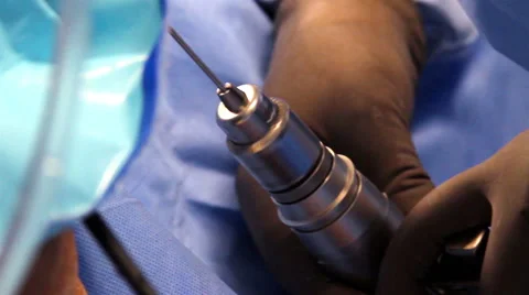 CLOSE UP. Surgeon using a drill during operation. Stock Footage 45823940
