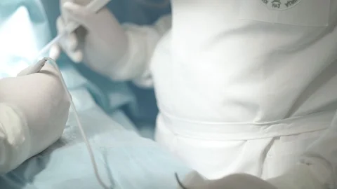 Close-up of surgeon's hands during operation dolly Stock Footage 101478440
