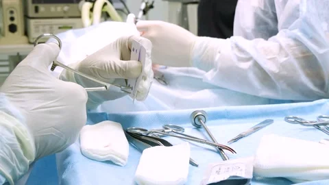 Close-up in surgery, the doctor's hands ... | Stock Video | Pond5