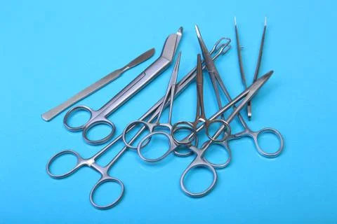 Close Up Surgical instruments and tools on blue mirror background. Selective Stock Photos