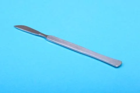 Close Up Surgical instruments and tools on blue mirror background. Selective Stock Photos