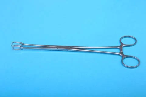 Close Up Surgical instruments and tools on blue mirror background. Selective Stock Photos