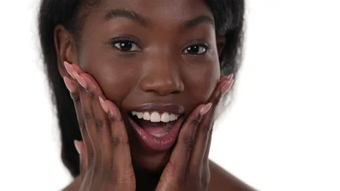 Close up of an surprised african woman's face, putting both hands on her face, Stock Footage 156572396