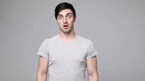 Close up of a surprised emotional man looking into the camera. Stock Footage