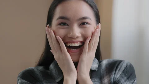 Close up surprised female face oh my god wow expression amazed excited asian Video stock 178484602