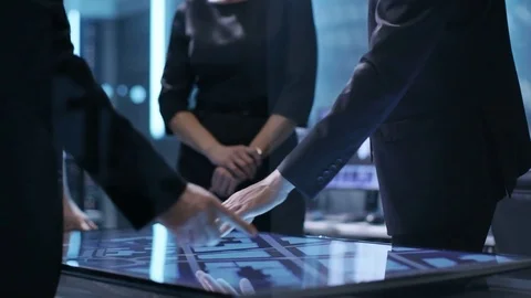Close-up of Surveillance Agency's Agents Hands on Interactive Touchscreen Table Stock Footage