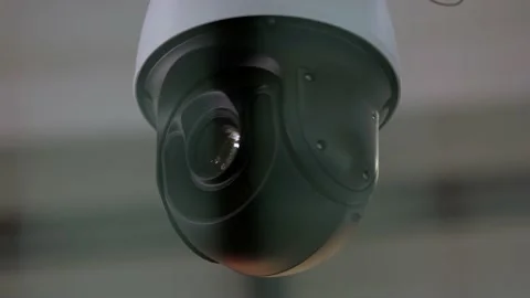 Close-up of surveillance video camera rotating around. Stock Footage 191199871