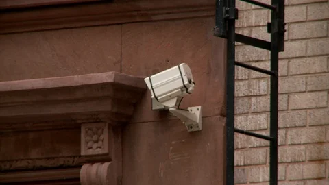 Close up of survelliance camera facing apartment building enterance, day. Video stock 110799193