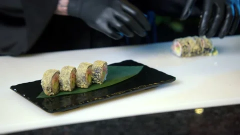Close up of sushi chef hands preparing japanese food. Stock Footage 239100321