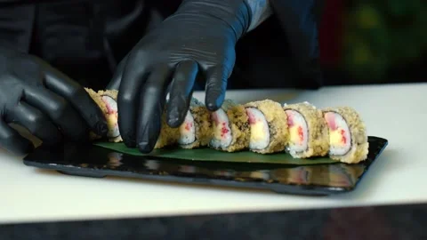 Close up of sushi chef hands preparing japanese food. Stock Footage 239100376