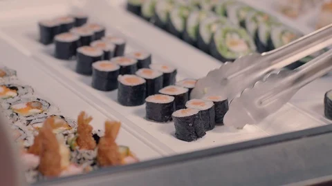 Close Sushi Grabbed With Pliers Stock Footage 96289427