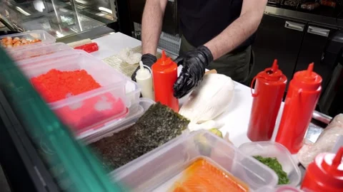 Close-up of the sushi preparation process in a Japanese restaurant. Stock Footage 326414214