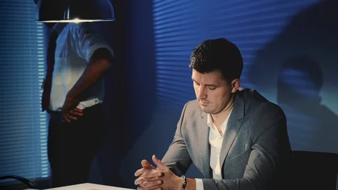 Close-up of suspected man forced to recognize the person in the photo during Video stock 122922951