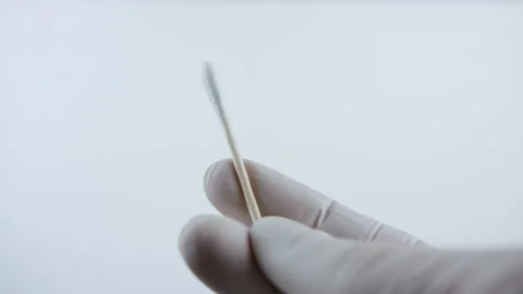Close up of swab for covid-19 testing. Doctor with white surgical gloves Stock-Footage 130384716