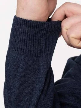 Close up of sweater cuff with hand Stock Photos