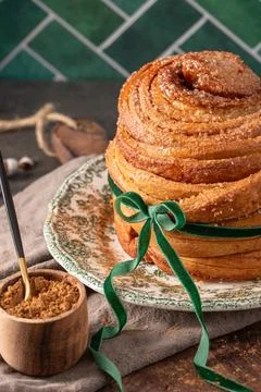 Close-up of a sweet flaky Easter bread topped with sugar crystals and tied .. Stock Photos