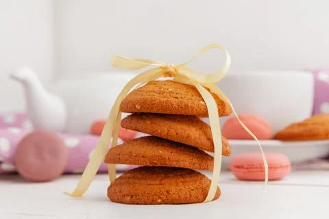 Close up of sweet tiny cookies stacked on a wooden table Stock Photos