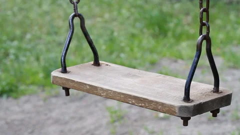Close-up of a swing with chains in the playground Stock Footage 130637480