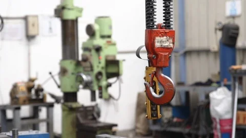 Close up of swinging Gantry crane hook with controller in factory Video stock 113383593
