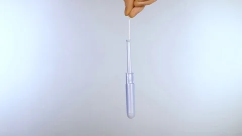 Close up swinging tampon with plastic applicator Stock Footage 72752225