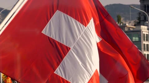 Close-up of the Swiss flag waving in the wind Stock Footage 303184299