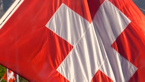 Close-up of the Swiss flag waving in the wind Stock Footage 303184322