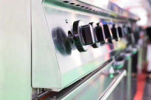 Close up switch of Kitchen burning gas cooker ; knob Stock Photos