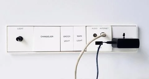 Close up switch panel with light switch, internet connection, audio, HDMI Stock Photos