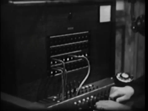 Close-up of switchboard operator connecting call Stock Footage 260255933
