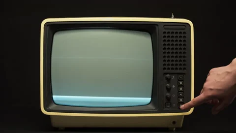 Close-up of switching channels on old retro television on black background, tv Stock Footage 156507252