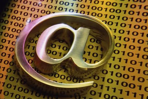 Close up of a @ symbol on binary codes Stock Photos