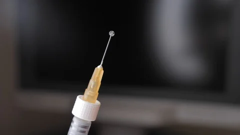 Close-up of syringe with drop (solid jelly-like soft material. hyaluronic acid Vídeos de archivo 122835435